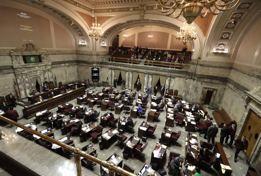 Lawmakers work on the Senate floor Wednesday, Feb. 19, at the Capitol in Olympia.