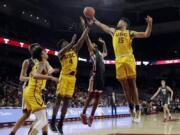 Southern California&#039;s Isaiah Mobley (15) grabs a rebound next to Washington State&#039;s Marvin Cannon during the second half of an NCAA college basketball game Saturday, Feb. 15, 2020, in Los Angeles.