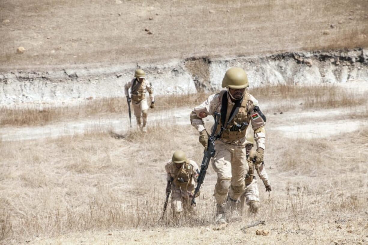 In this Tuesday Feb. 18, 2020, photo, Burkina Faso paratroopers commando exercise under the supervision of Dutch special forces during U.S. military-led annual counterterrorism exercise in Thies, Senegal. More than 1,500 service members from the armies of 34 African and partner training nations have assembled for the Flintlock exercises in Senegal and Mauritania, the two countries in West Africa&#039;s sprawling Sahel region that so far have not been hit by violence from extremists linked to al-Qaida or the Islamic State group.