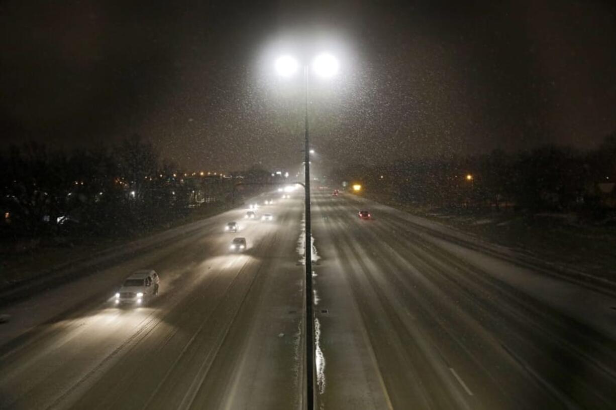 Commuters travel in snow and a wintry mix on I-244  Wednesday, Feb. 5, 2020 in Tulsa, Okla. A powerful winter storm dropped snow throughout parts of Texas and Oklahoma early Wednesday.