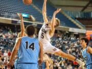 Union's Tanner Toolson flails after the ball is knocked away on a layup attempt during a 4A State semifinal game on Friday at the Tacoma Dome. Union lost 63-55.