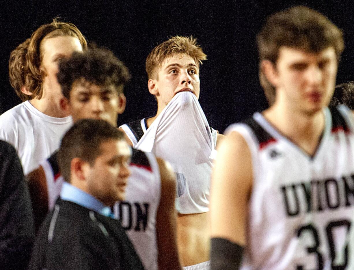 Union's Tanner Toolson stares at the scoreboard after the Titans' 63-55 defeat to Central Valley in the 4A State semifinal on Friday at the Tacoma Dome.