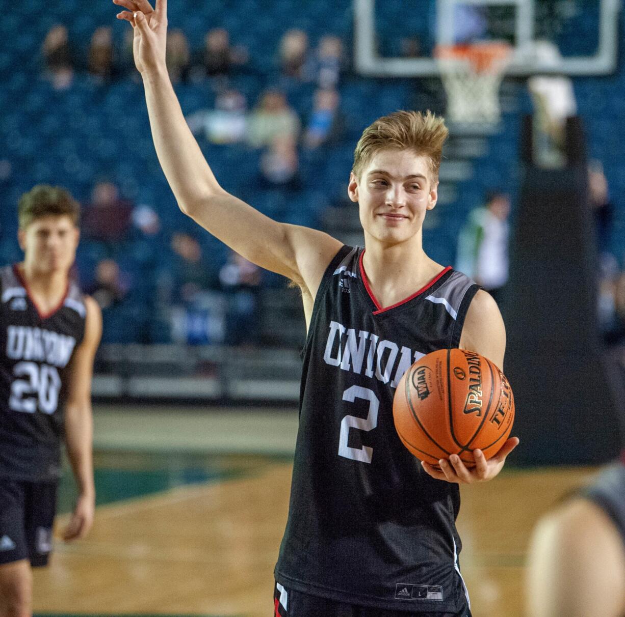 Union's Tanner Toolson waves to his fans one final time after a 4A State trophy game Saturday at the Tacoma Dome. Union finished third.