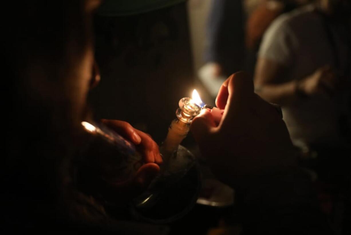 A person smokes marijuana at a private residence in the West Loop on Jan. 25, 2020 in Chicago.