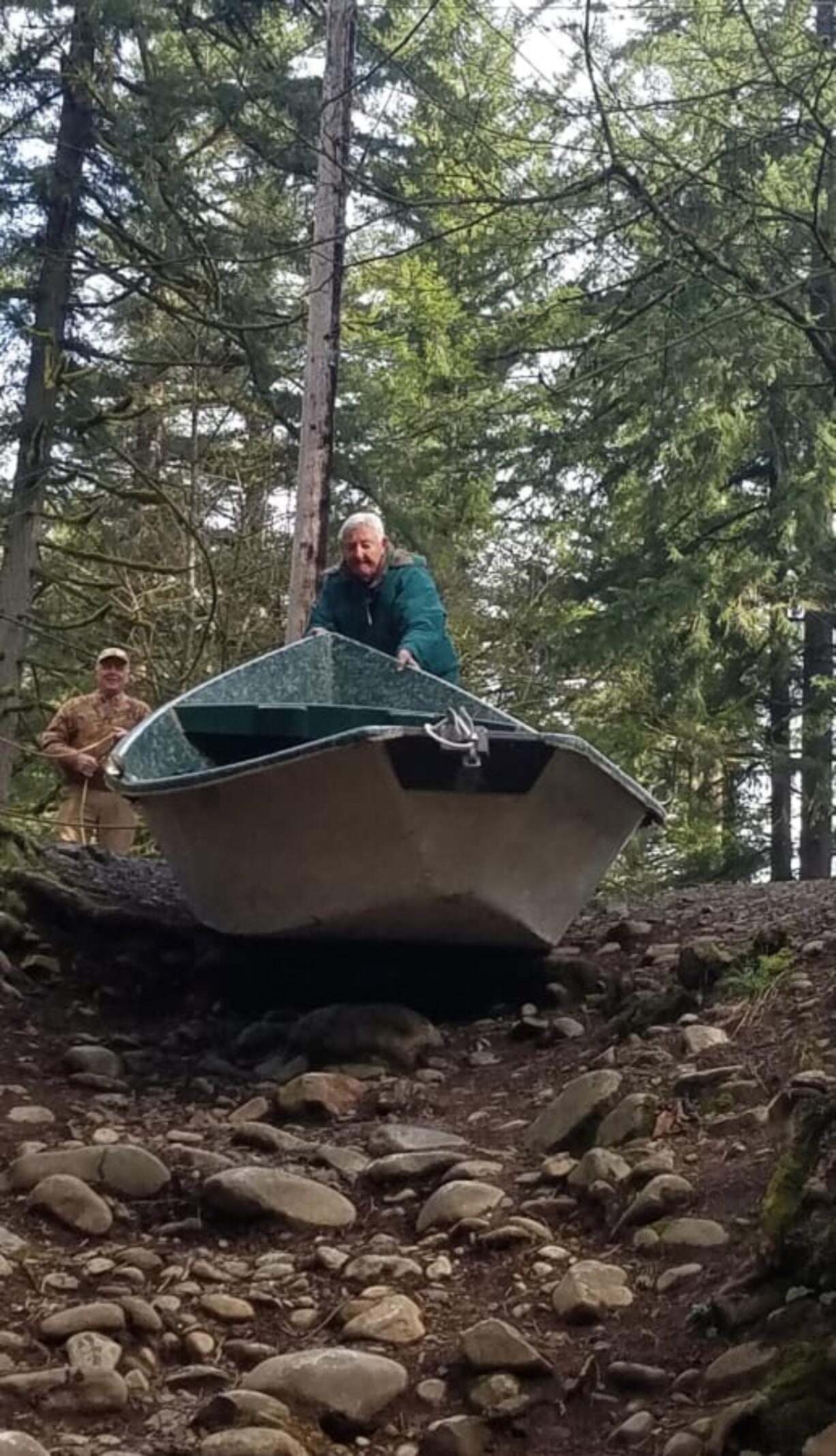 Harry Barber, left, and Joe Broz of Clark County launch a drift boat at the Three Mile Launch on the Washougal River. The WDFW has proposed closing the site, which is used by fishermen, kayakers, and other recreationists to float the lower 3 miles of the river.