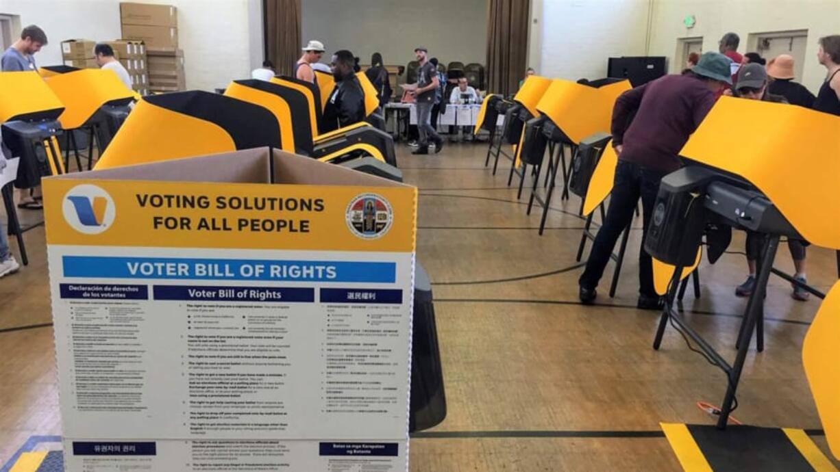 Voters cast their ballots at the Hollywood Recreation Center on Super Tuesday. This was the first election using the country&#039;s only publicly owned voting system.