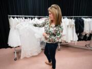 Colleen Sharp shows the &quot;Communion Closet&quot; at St. Katherine of Sienna Church, where families can check out slightly used communion outfits, March 9 in Philadelphia, Pa.