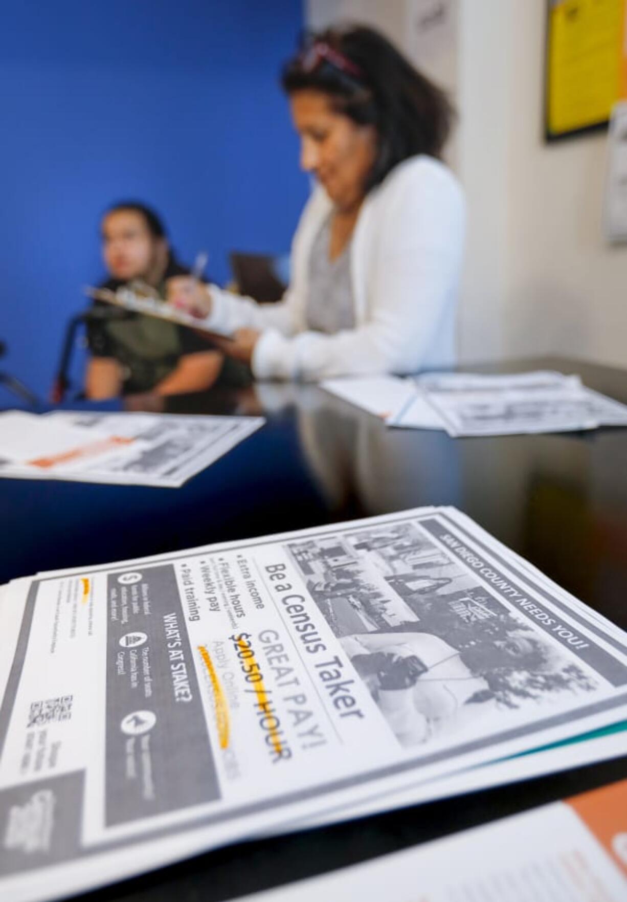 Patricia Bird, foreground, and her son, Joel Bird, attended a United States Census Bureau recruiting session in December for the residents of the Independence Point Apartment Homes near Lincoln High School, held at Independence Point in San Diego, Calif.