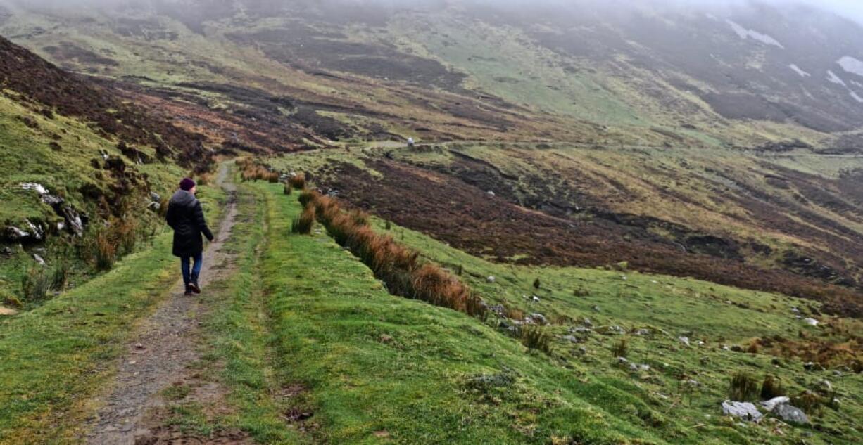 The writer&#039;s wife, Mary Carpenter, walks along the Pilgrims Path near Teelin in County Donegal. The West Coast of Ireland is best explored on foot.