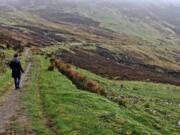 The writer&#039;s wife, Mary Carpenter, walks along the Pilgrims Path near Teelin in County Donegal. The West Coast of Ireland is best explored on foot.