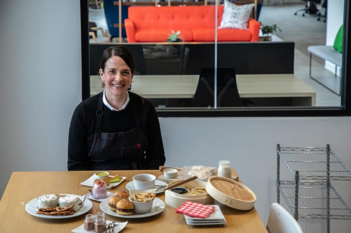 Eleanore Eckstrom, director of product design, on March 10, 2020, displays dishes such as sliders, pot stickers, nuggets and chocolate mousse that are made from an alternative protein at Nature&#039;s Fynd , based in Chicago&#039;s Back of the Yards neighborhood. Nature&#039;s Fynd uses a microbe found in the volcanic hot springs of Yellowstone National Park to create a &#039;complete protein&#039; that can be used to make faux meat, dairy, and other food items.