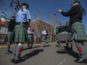 Members of the Fort Vancouver Pipe Band gather outside Hough Elementary School before the Paddy Hough Parade in 2019.