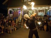 Mike Gorman, of Vancouver, practices fire dancing at during the new moon drum circle at Wattle Tree Place in Vancouver.