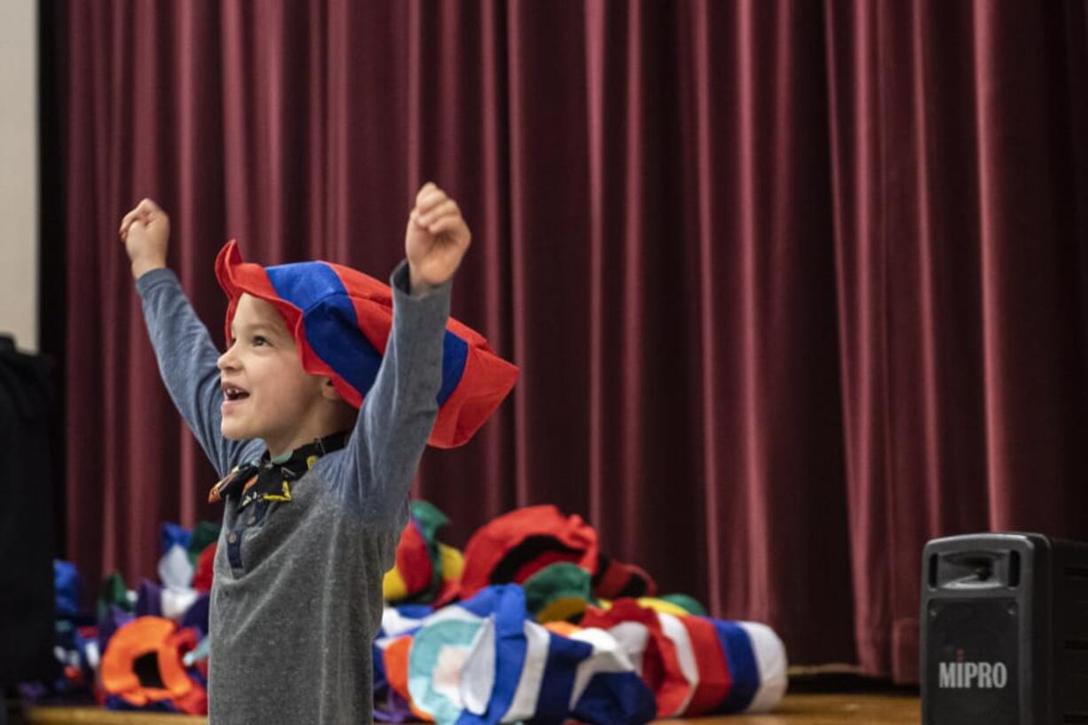 Henry Boge reacts to receiving a Dr. Seuss hat during Read Across America Day at Chinook Elementary School on Monday morning.