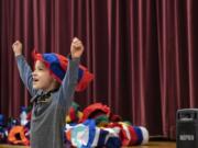 Henry Boge reacts to receiving a Dr. Seuss hat during Read Across America Day at Chinook Elementary School on Monday morning.