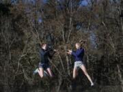 High jumpers Jerrica Pachl, left, and Ellie Saunders, are good friends and teammates at Seton Catholic. They also finished first and second at state last year.