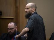 Dustin Zapel, who fatally stabbed two men who lived in his apartment complex in July 2017, awaits opening statements in his double murder trial Tuesday in Clark County Superior Court.