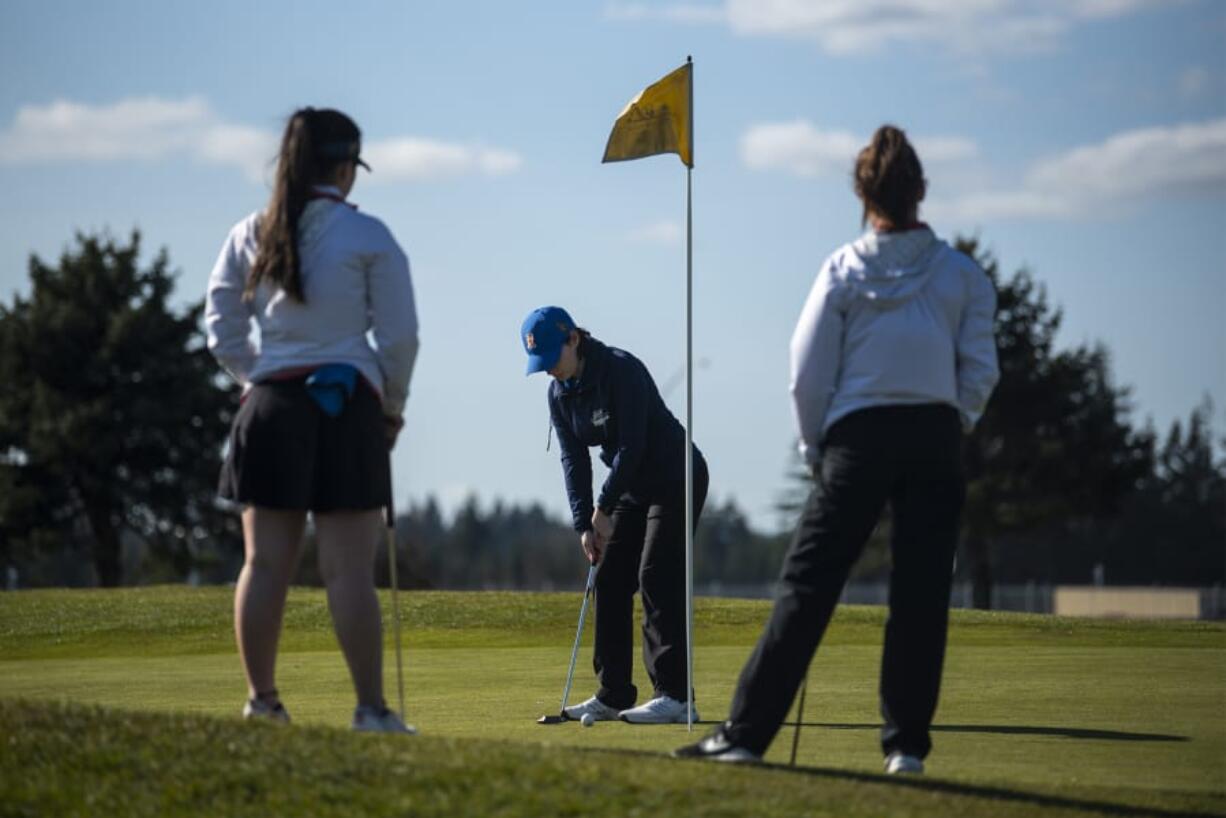 Ridgefield golfer Samantha Fenton putts during a match against Union at Tri Mountain Golf Course on Thursday.