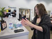 Felicia Parkinson, a client at the Vancouver Navigation Center, keeps her hands clean Friday. She&#039;s trying to avoid crowds, but it&#039;s impossible when you live out of your car, she said.