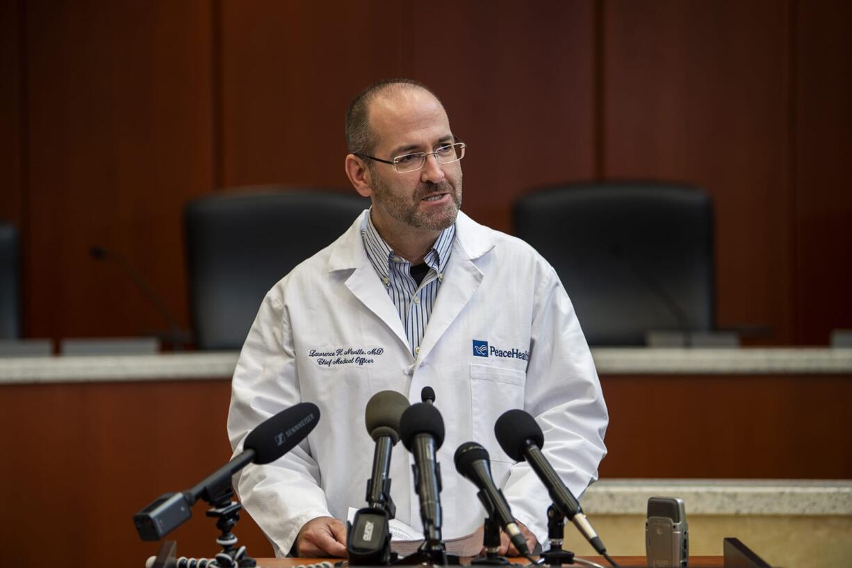 Dr. Lawrence Neville, chief medical officer at PeaceHealth Southwest, speaks during a COVID-19 press conference at the Clark County Public Service Center on Friday, March 13, 2020.