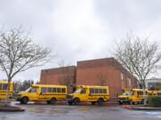 Buses line up to transport students from Covington Middle School on March 13, 2020.