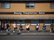 The Beauty Temptations Salon cosmetologists are pictured in Washougal on Thursday. The women had to shutter the salon Tuesday after the COVID-19 outbreak forced closures of salons across the state, effectively putting eight self-employed cosmetologists out of business.