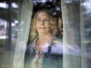 Denise Weston looks out the window at her home in Vancouver. Weston, who has bipolar II, has set up a virtual meeting for her next therapy next session. The tools she&#039;s learned from counseling have helped her during this time of added stress, Weston said. Some therapists in Clark County have shifted to virtual appointments to stop the spread of COVID-19.