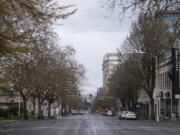 Activity is scarce Tuesday on Washington Street in downtown Vancouver, following Gov. Jay Inslee&#039;s temporary stay-at-home order to slow the spread of COVID-19.