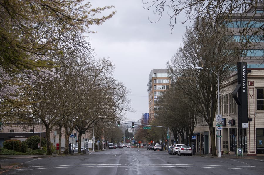 Activity is scarce Tuesday on Washington Street in downtown Vancouver, following Gov. Jay Inslee&#039;s temporary stay-at-home order to slow the spread of COVID-19.