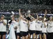 Portland players celebrate after defeating San Diego in an NCAA college basketball game in the final of the West Coast Conference women's tournament Tuesday, March 10, 2020, in Las Vegas.