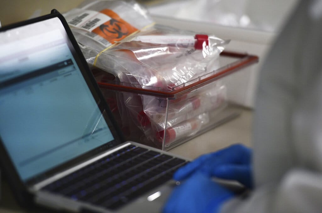 A lab tech tests samples for COVID-19 coronavirus at the Colorado Department of Public Health and Environment Laboratory Services Division in Denver. A company in Vancouver is working to develop a home test for COVID-19.