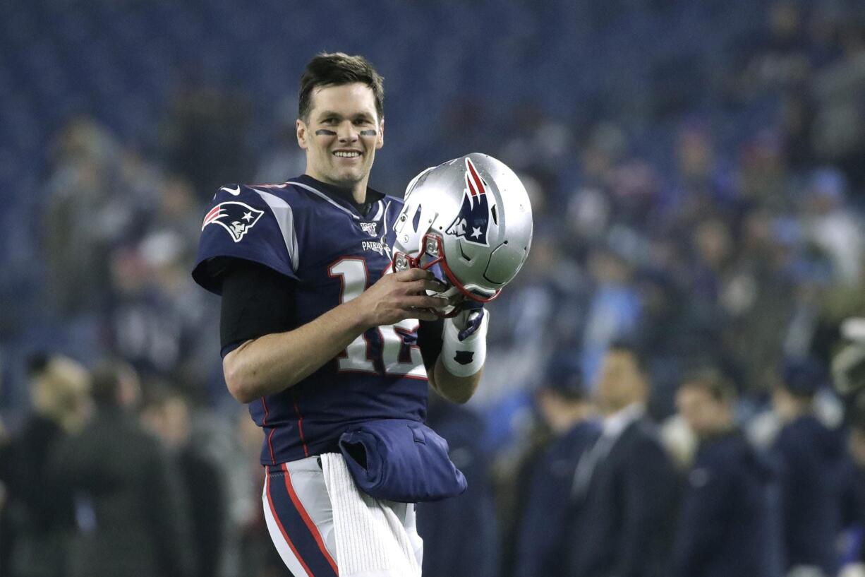 FILE - In this Jan. 4, 2020, file photo, New England Patriots quarterback Tom Brady warms up before an NFL wild-card playoff football game against the Tennessee Titans in Foxborough, Mass. Tom Brady is an NFL free agent for the first time in his career.  The 42-year-old quarterback with six Super Bowl rings  said Tuesday morning, March 17, 2020, that he is leaving the New England Patriots.