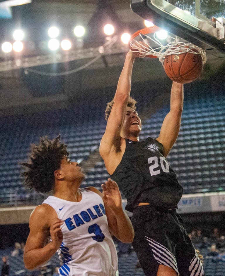 Battle Ground's Kaden Perry slams home a dunk in a 4A State round-of-12 game Wednesday at the Tacoma Dome.