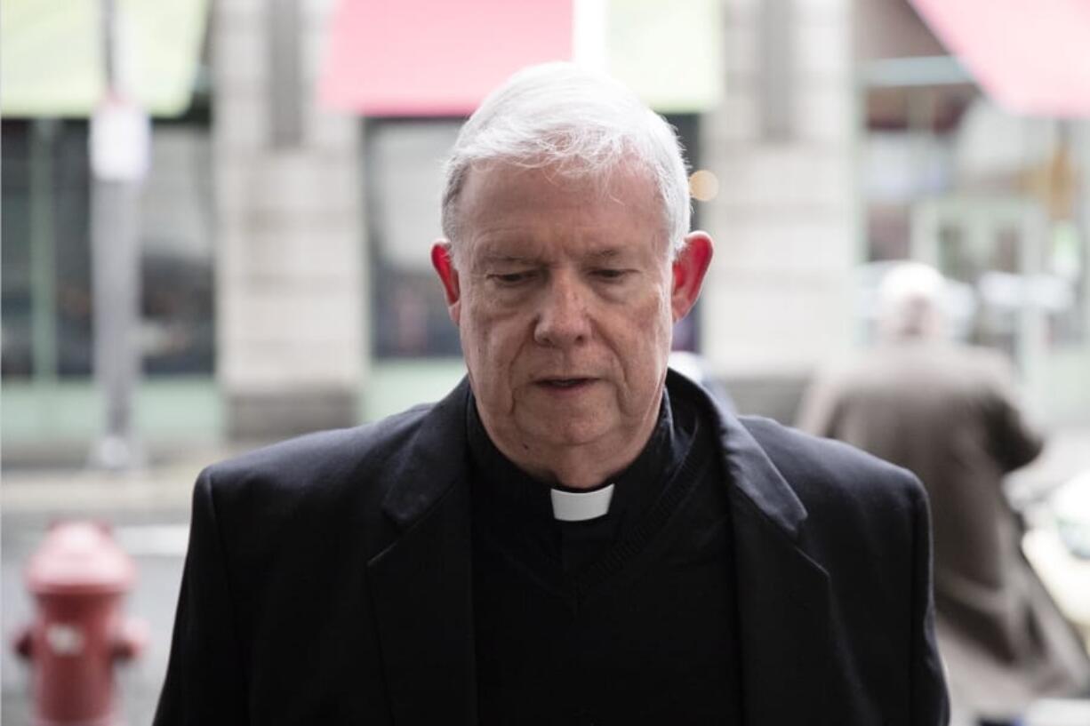 In this March 11, 2020 photo, Monsignor William Lynn arrives for a pretrial hearing at the center for criminal justice in Philadelphia. Lynn, 69, is the only Roman Catholic church official in the U.S. ever sent to prison over his handling of priest sex-abuse complaints. He has served 33 months in prison, but is set to be retried Monday, Monday, March 16, on a child endangerment charge after a Pennsylvania appeals court overturned his 2012 conviction.