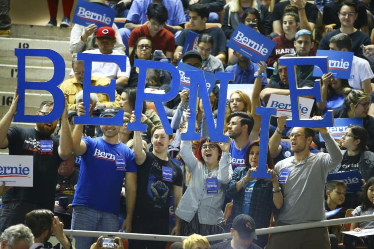 Supporters of Democratic presidential candidate Sen. Bernie Sanders, I-Vt., cheer as they wait for a rally to begin Thursday in Phoenix. (ross d.