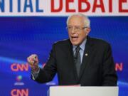 In this Sunday, March 15, 2020, photo, Sen. Bernie Sanders, I-Vt., with former Vice President Joe Biden, speaks during a Democratic presidential primary debate at CNN Studios in Washington. What might be the final showdown between the two very different Democratic candidates takes place Tuesday, March 17, 2020, during Florida&#039;s presidential primary.