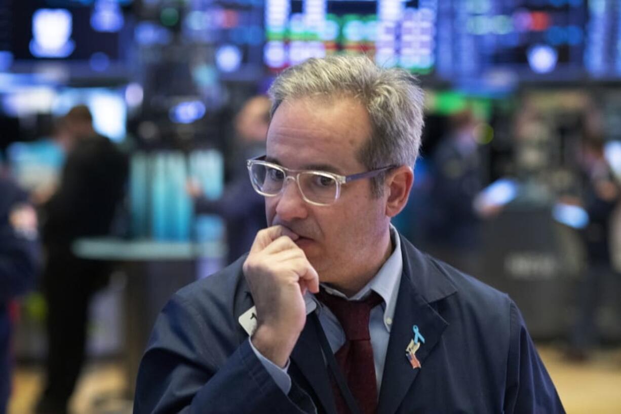 A trader works the floor at the New York Stock Exchange, Tuesday, March 17, 2020 in New York.