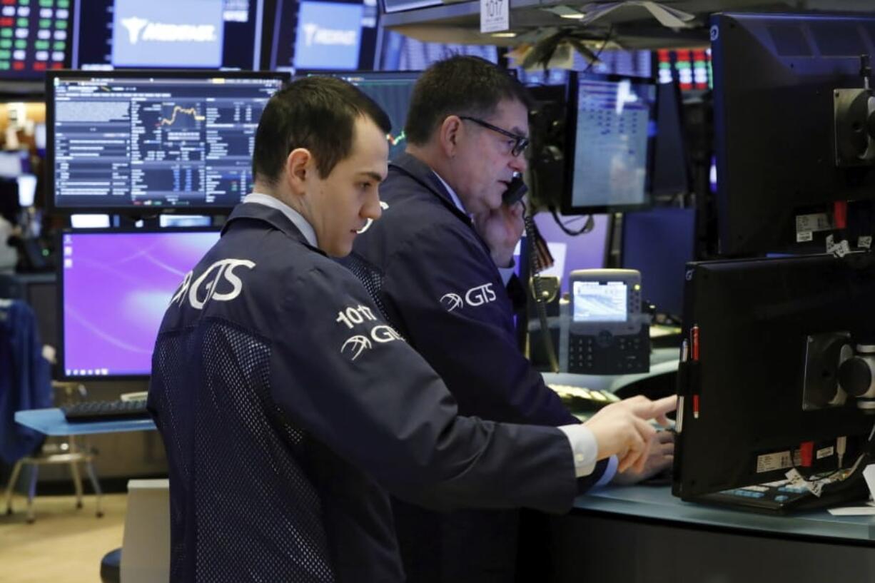 A pair of specialists prepare for the day&#039;s trading activity on the floor of the New York Stock Exchange, Monday, March 2, 2020. Wall Street is set to post more losses at the opening bell, coming on top of last week&#039;s drop, which was the worst since the global financial markets over a decade ago.