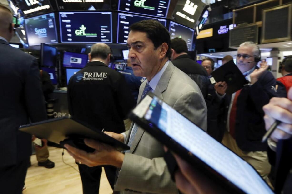 Trader Mark Muller works on the floor of the New York Stock Exchange, Tuesday, March 3, 2020. Stocks are opening lower on Wall Street after the Group of Seven countries held off on giving the global economy new stimulus to help it cope with the coronavirus outbreak.