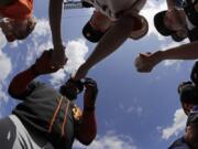 San Francisco Giants&#039; Pablo Sandoval signs autographs for fans before a spring training baseball game against the Arizona Diamondbacks, Monday, March 2, 2020, in Scottsdale, Ariz.(AP Photo/Darron Cummings)