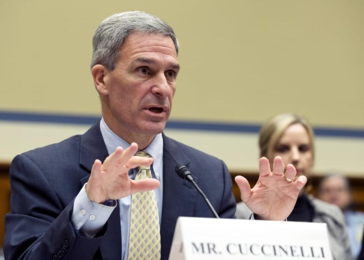 FILE - In this Oct. 30, 2019, file photo, Ken Cuccinelli, acting director for the U.S. Citizenship and Immigration Services, U.S. Department of Homeland Security, testifies during House Oversight subcommittee hearing on deportation of critically ill children on Capitol Hill in Washington. A federal judge has ruled that Cuccinelli was unlawfully appointed to lead the U.S. Citizenship and Immigration Services agency and, as a result, lacked authority to give asylum seekers less time to prepare for initial screening interviews.