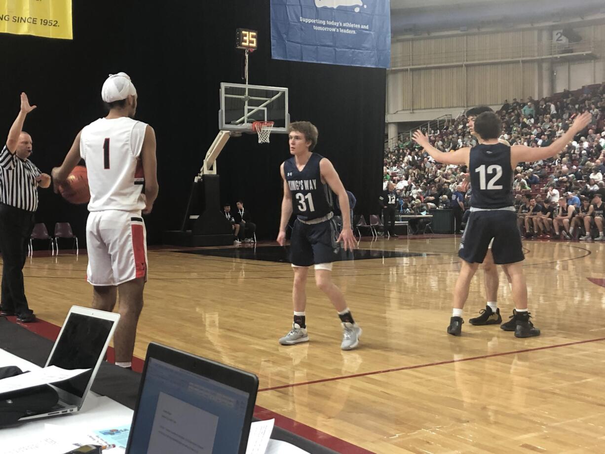 King's Way Christian's Brady Metz (31) defends an inbounds pass by Seattle Academy's Teja Singh in the 1A state quarterfinals on Thursday in Yakima (Micah Rice/The Columbian)