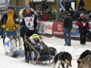 Musher Kristy Berington (bib No. 4) of Knik, Alaska, leaves the start line before the ceremonial start of the Iditarod Trail Sled Dog Race Saturday, March 7, 2020, in Anchorage, Alaska. The real race starts March 8 about 50 miles north of Anchorage, with the winner expected in the Bering Sea coastal town of Nome about 10 or 11 days later.