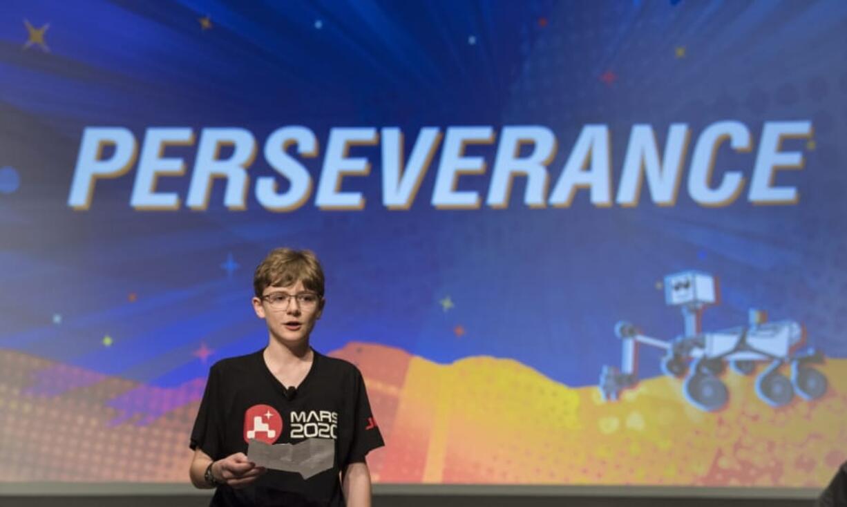 Alex Mather, whose submission, Perseverance, was chosen as the official name of the Mars 2020 rover, reads his essay entry Thursday at Lake in Burke, Va.