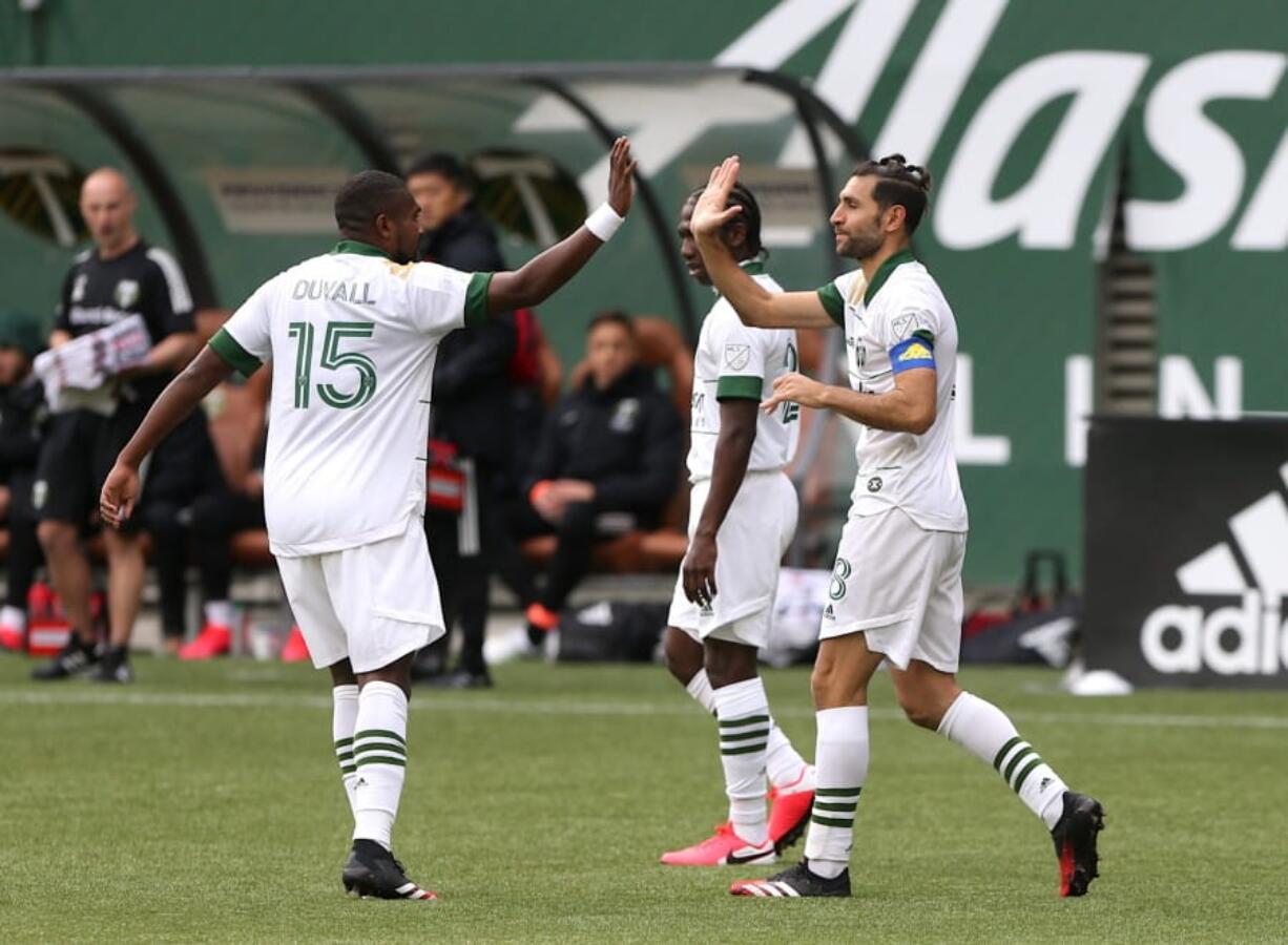 Portland Timbers&#039; Diego Valeri, right, celebrates his goal with his teammate in an MLS soccer match against Nashville SC in Portland, Ore., Sunday, March 8, 2020.