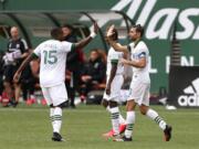 Portland Timbers&#039; Diego Valeri, right, celebrates his goal with his teammate in an MLS soccer match against Nashville SC in Portland, Ore., Sunday, March 8, 2020.
