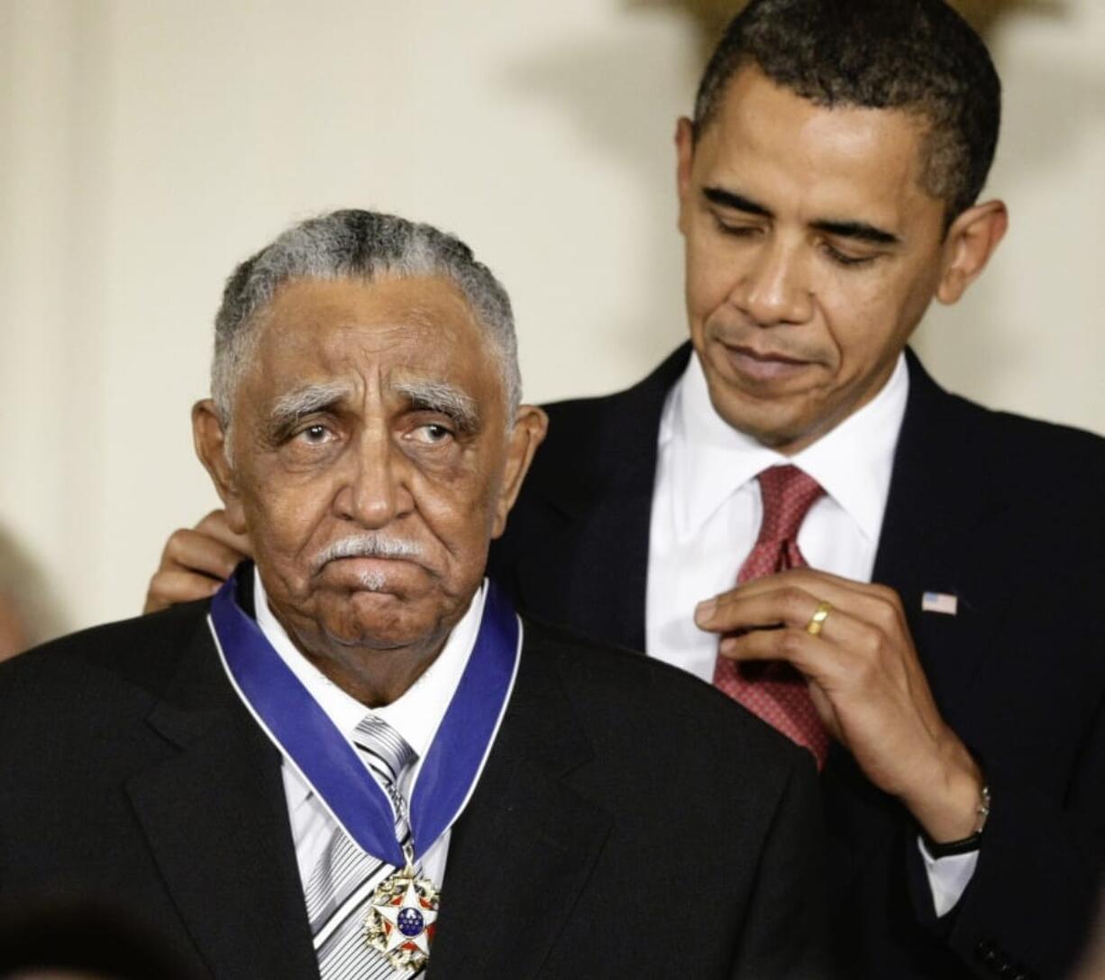 FILE - In this Aug. 12, 2009, file photo, President Barack Obama presents a 2009 Presidential Medal of Freedom to the Rev. Joseph E. Lowery n the East Room of the the White House in Washington. Lowery, a veteran civil rights leader who helped the Rev. Dr. Martin Luther King Jr. found the Southern Christian Leadership Conference and fought against racial discrimination, died Friday, March 27, 2020, a family statement said. He was 98. (AP Photo/J.