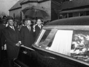 The Rev. Martin Luther King Jr. leads a procession behind the casket of Jimmie Lee Jackson during funeral rites March 1, 1965, at Marion, Ala. From left, John Lewis, the Rev. Ralph Abernathy, King and the Rev. Andrew Young.