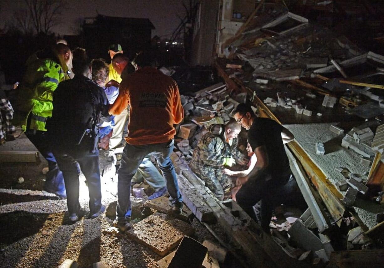 Rescue workers free Bill and Shirley Wallace from their home that collapsed, trapping them under rubble after a tornado hit area Tuesday, March 3 2020, in Mt. Juliet, Tenn.