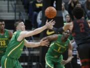 Oregon guard Payton Pritchard (3) steals the ball from Stanford guard Bryce Wills (2) during the first half of an NCAA college basketball game in Eugene, Ore., Saturday, March 7, 2020.